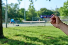 person holding cetilar on field